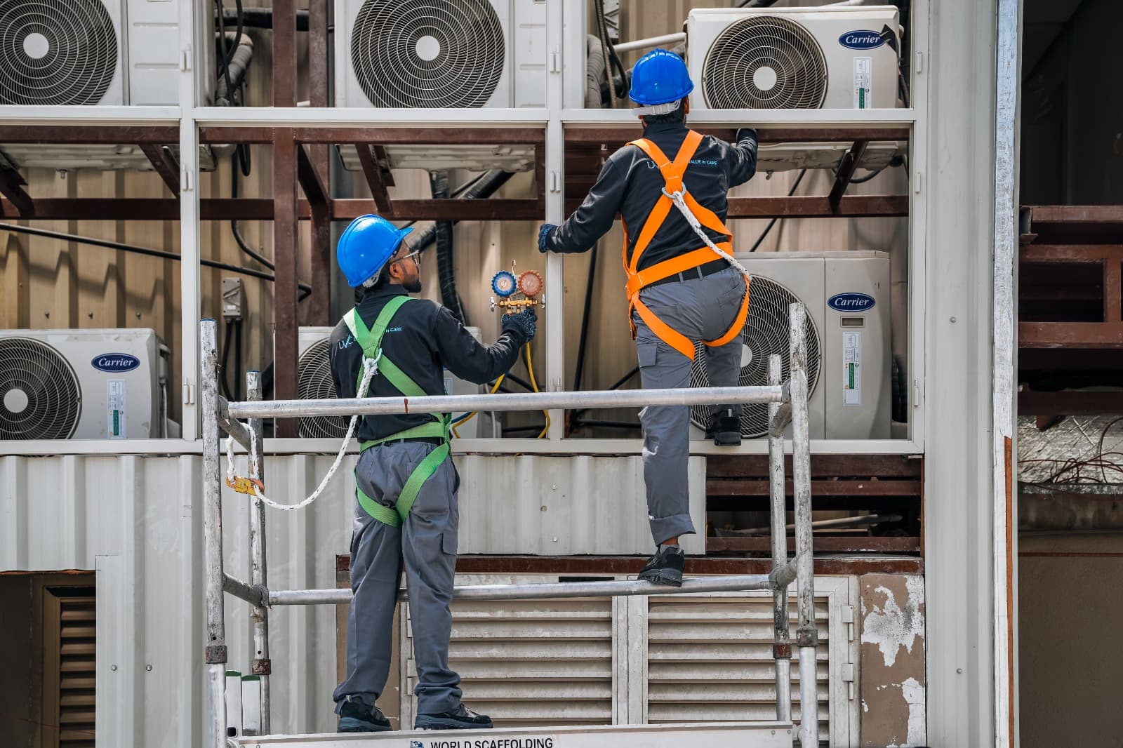 HVAC technicians preparing equipment